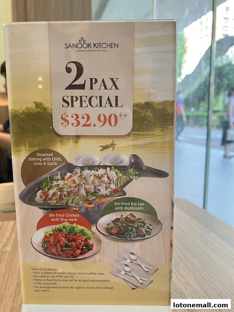 A menu board for Sanook Kitchen featuring a 2-person special with three Thai dishes.