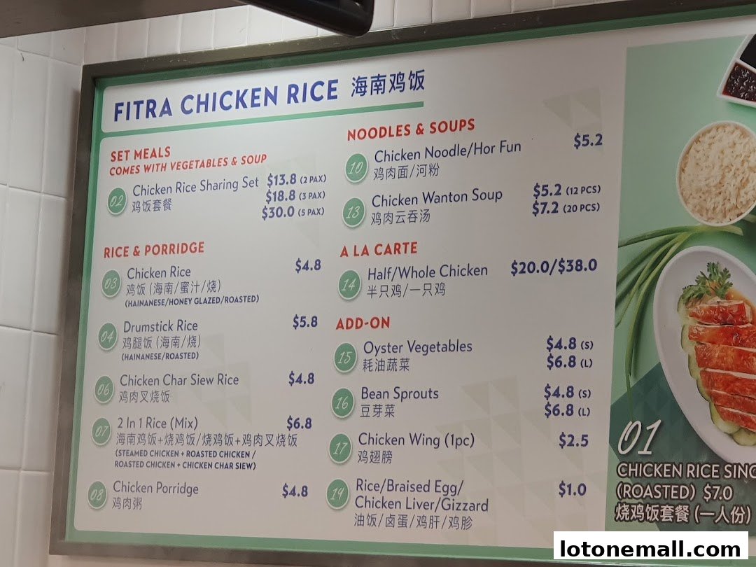 A menu board for Fitra Chicken Rice, featuring various chicken rice dishes, noodles, soups, and side orders.