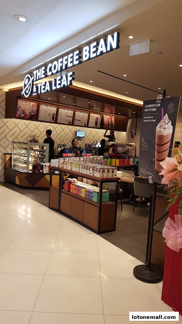 The Coffee Bean & Tea Leaf shop interior with a display of coffee products and a menu board.
