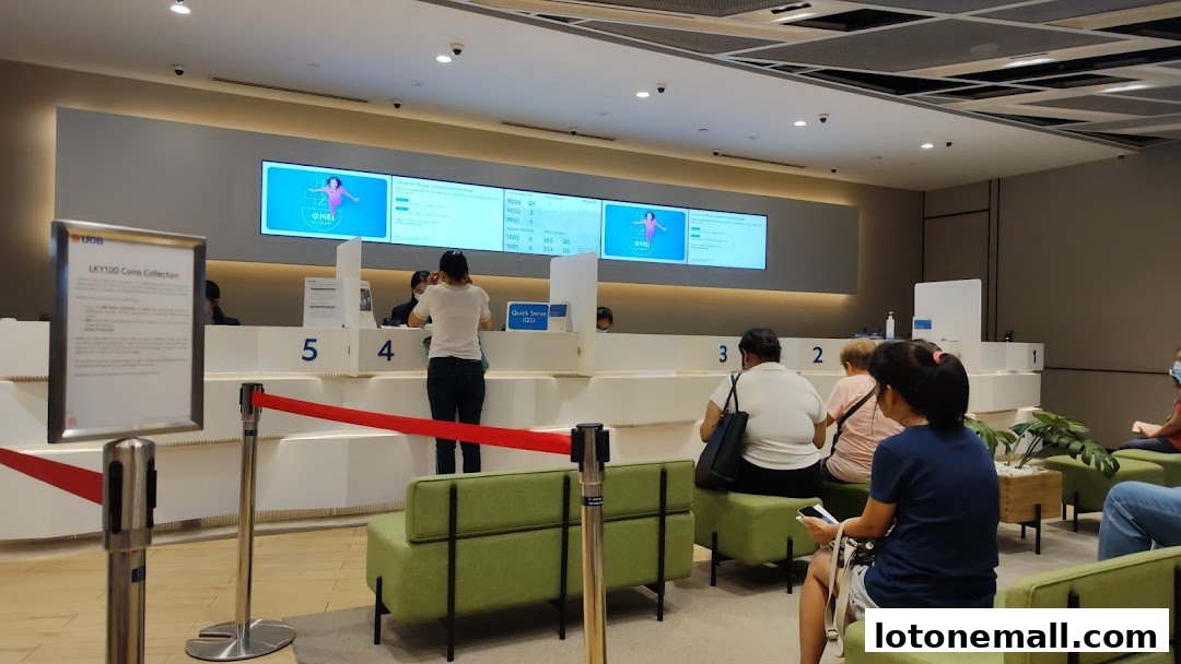 Interior of a UOB bank branch with customers waiting and staff at counters.