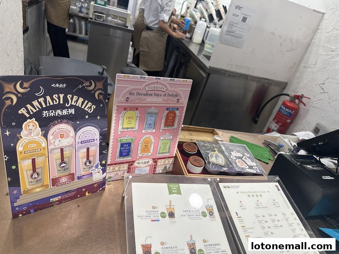 A display of bubble tea products and a menu at CHICHA San Chen.