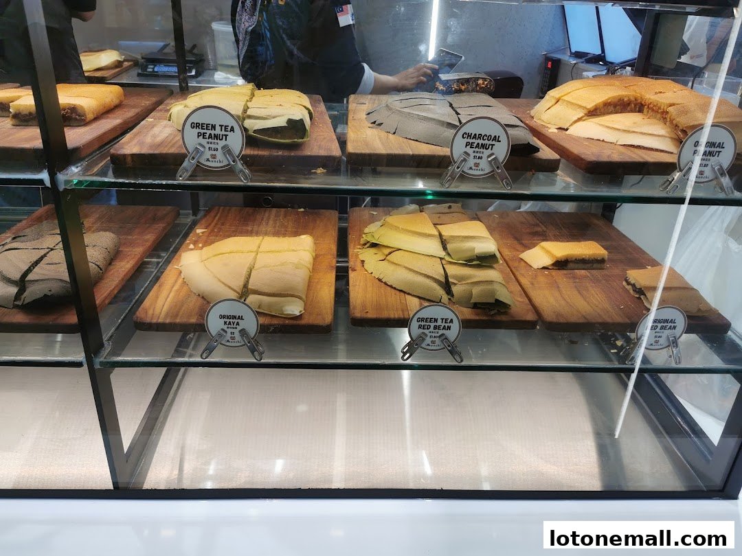 A display case filled with various flavors of freshly made pancakes.