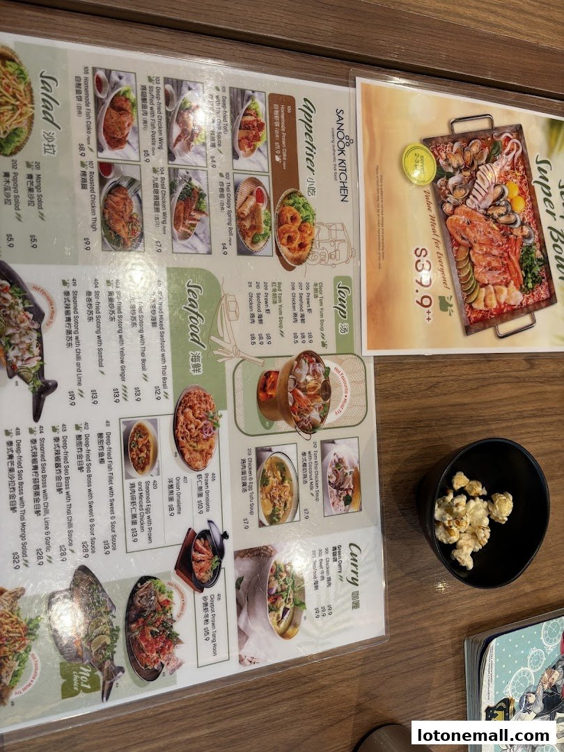 A menu from Sanook Kitchen featuring various Thai dishes, including seafood, appetizers, and soups.