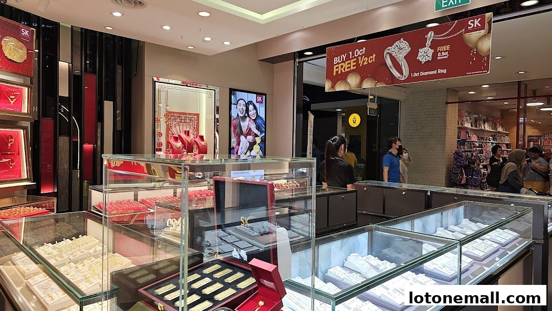 Interior view of a jewelry store showcasing gold and diamond pieces in display cases.