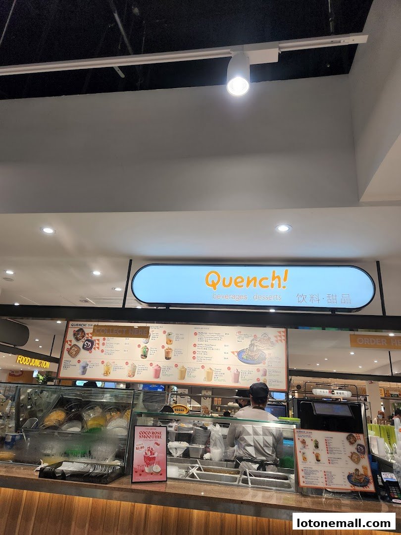 A food court stall with a menu board displaying various beverages and desserts.