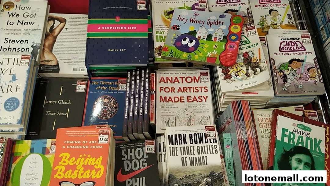A diverse selection of books, including popular titles and children's books, displayed on shelves.