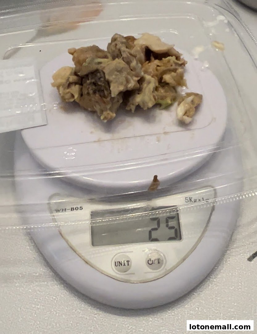 A close-up of food items being weighed on a digital scale.