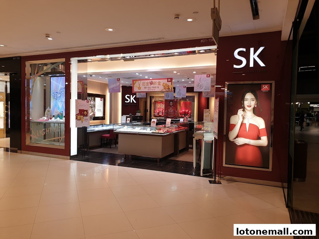 The exterior of the SK Jewellery store, showcasing displays and a large advertisement.