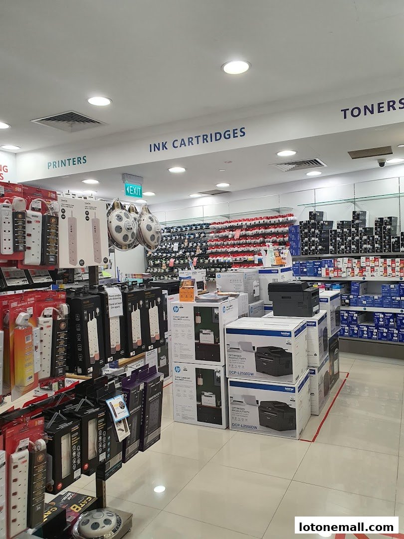 Interior view of a Challenger store showcasing printers, ink cartridges, and toners.