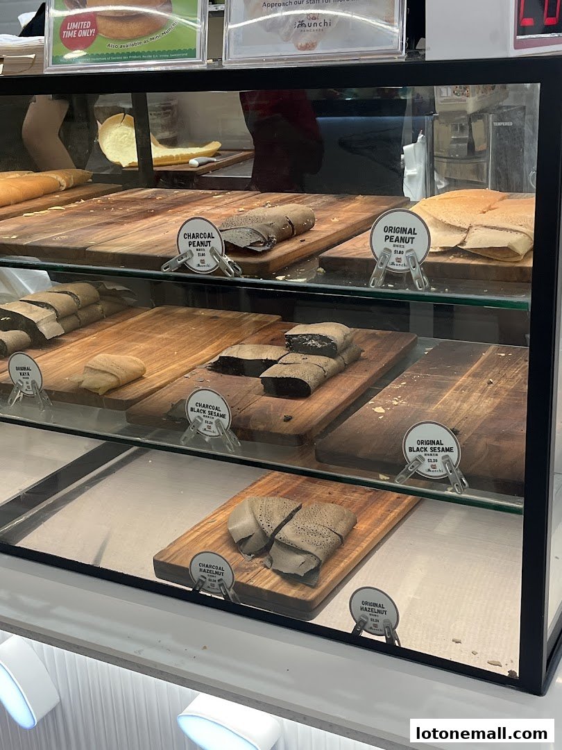 A display case filled with various flavors of pancakes at Munchi Pancakes.