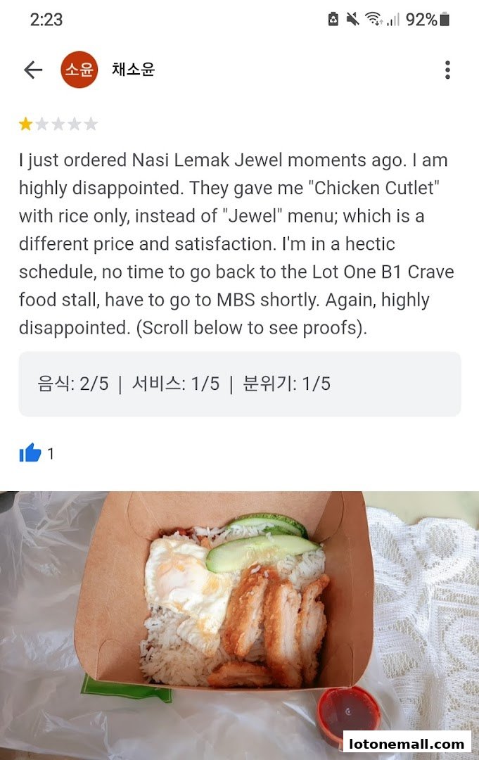 A customer review of Nasi Lemak with a picture of the dish.