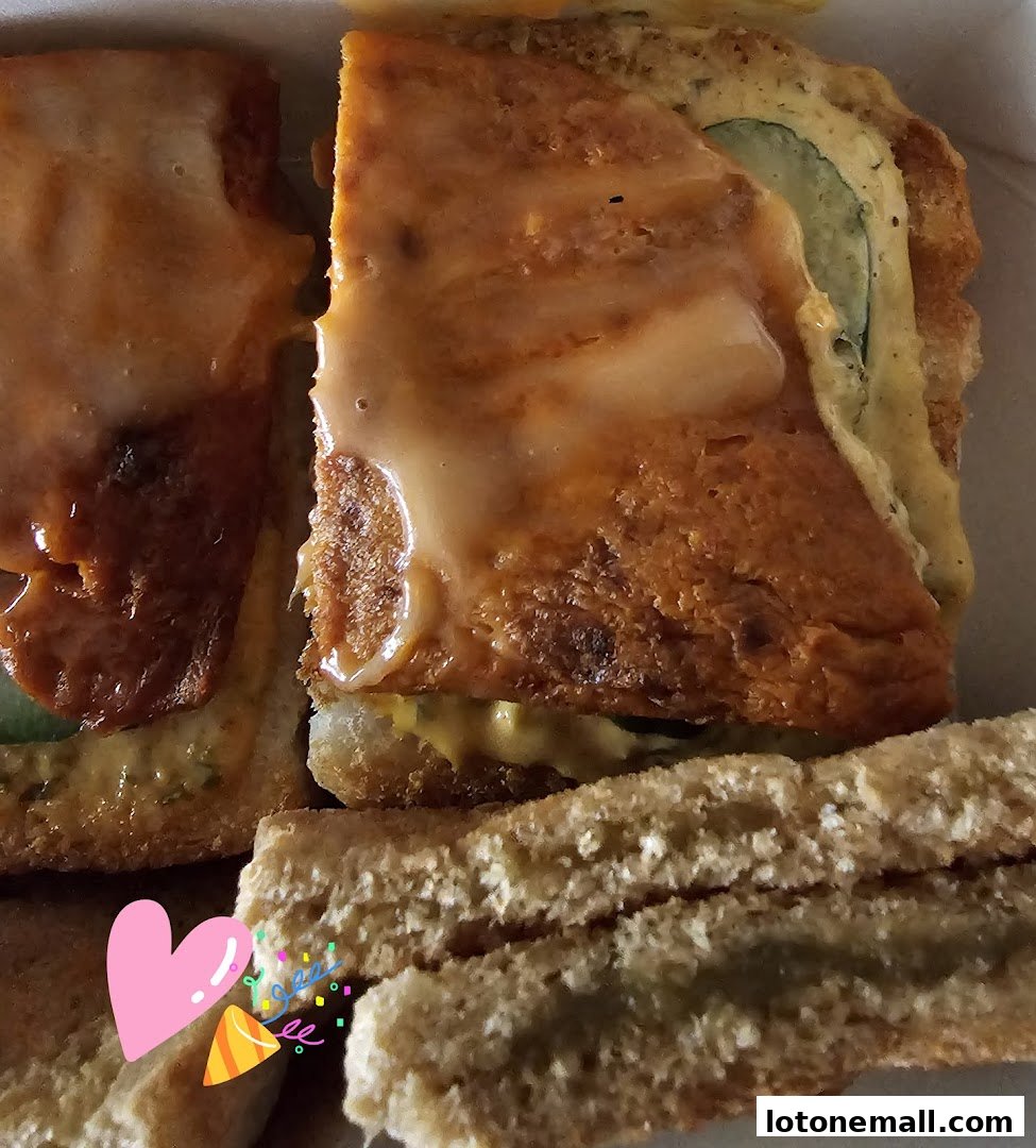 Close-up of delicious toast with a sweet glaze and savory filling.