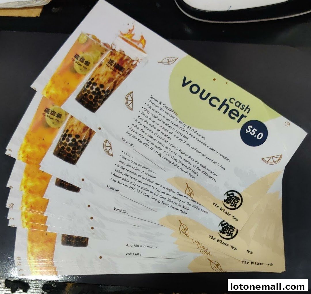 A stack of $5 cash vouchers for The Whale Tea with images of bubble tea.