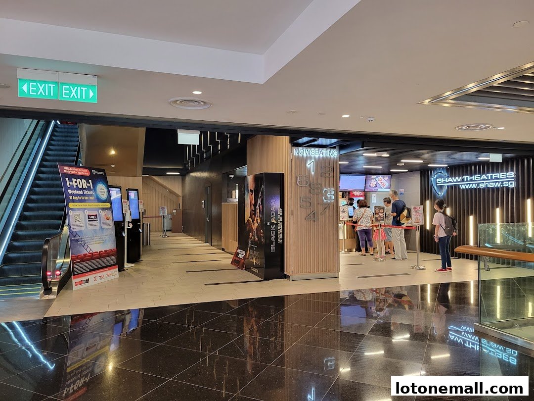 The entrance to Shaw Theatres with a ticket counter and movie posters.