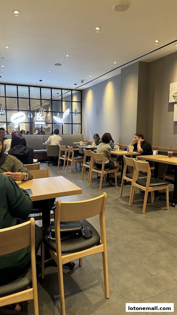 Interior of The Coffee Bean & Tea Leaf with customers seated at tables.