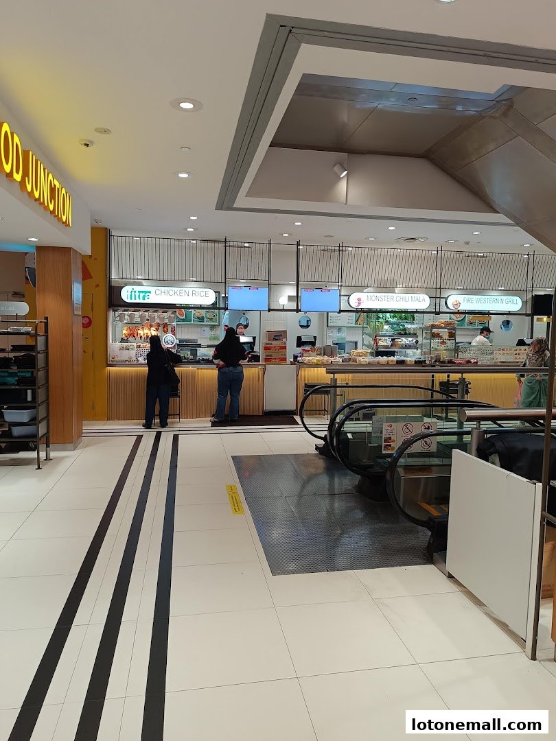 A food court with multiple stalls, including Chicken Rice and Fire Western N Grill.