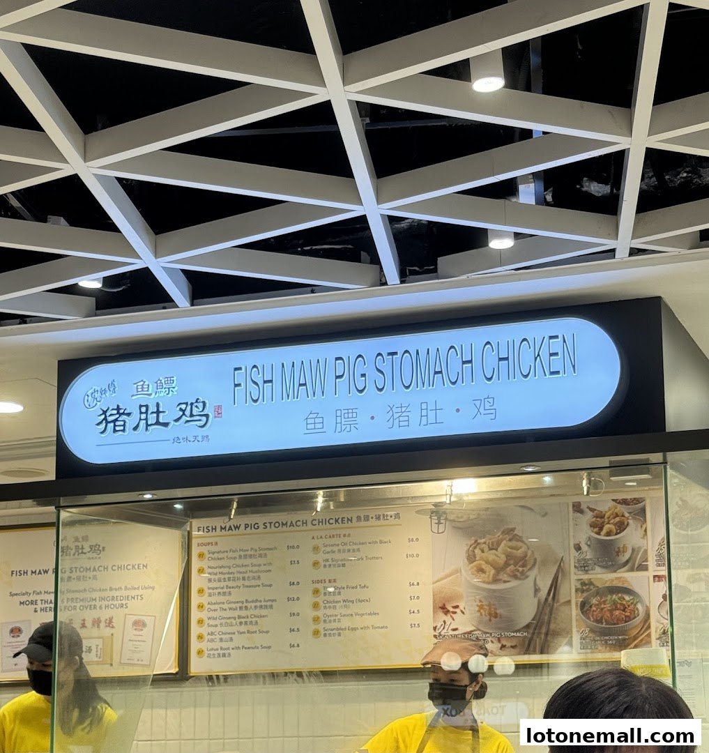 A food court stall sign and menu displaying various chicken soup and side dishes.