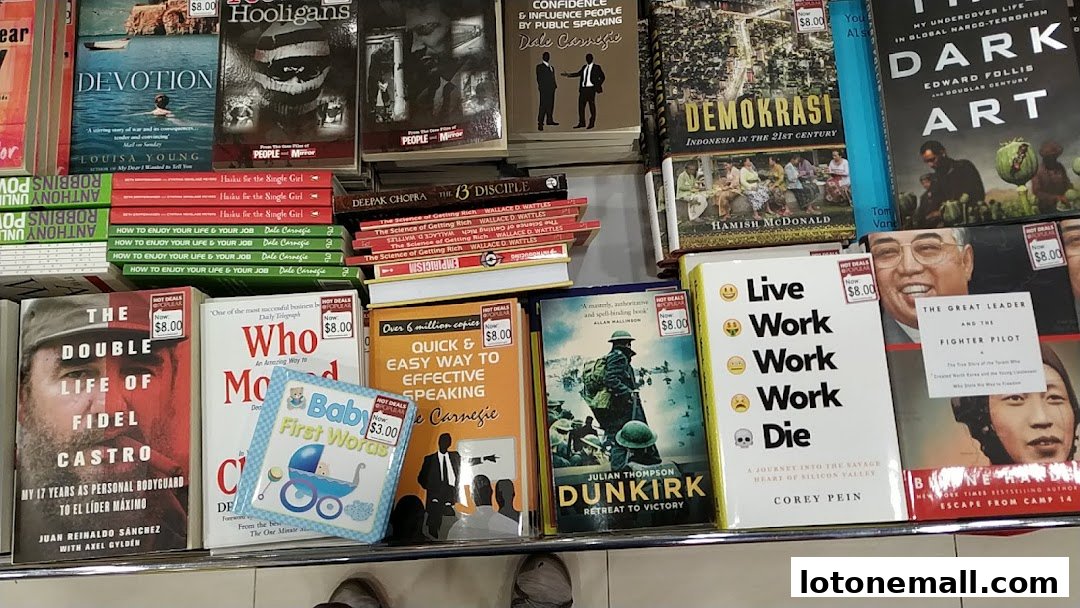 A display of various books, including titles on history, self-help, and biographies, with some marked as hot deals.