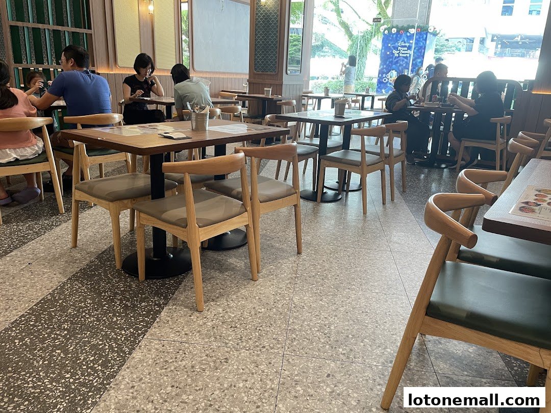 Interior view of Sanook Kitchen with diners seated at tables.