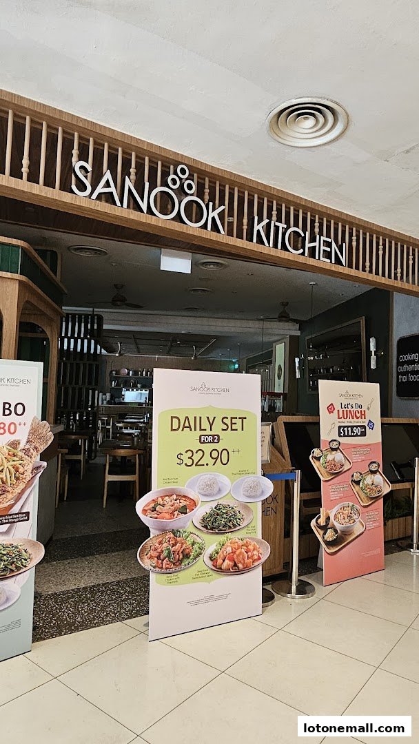 The entrance of Sanook Kitchen restaurant with promotional posters for daily sets and lunch.
