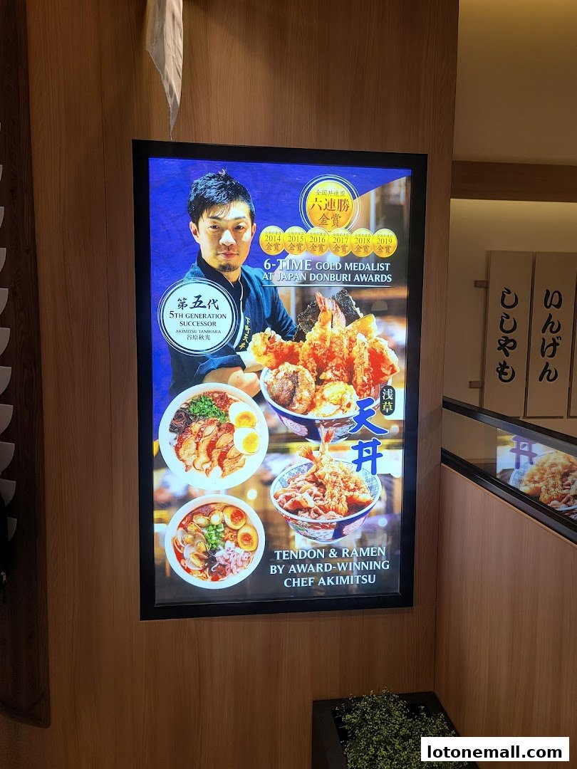 A glowing advertisement for Milan Shokudo featuring Chef Akimitsu and his award-winning Tendon & Ramen.