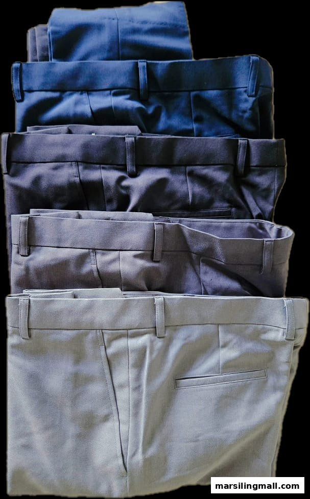 A stack of neatly folded men's trousers in various shades of blue and grey.