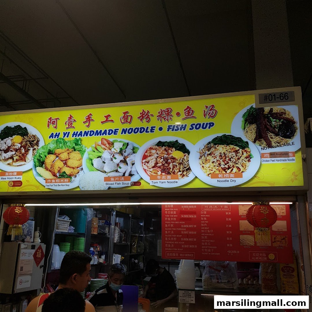 A vibrant menu board showcasing various handmade noodle and fish soup dishes at Ah Yi Handmade Noodle Fish Soup.