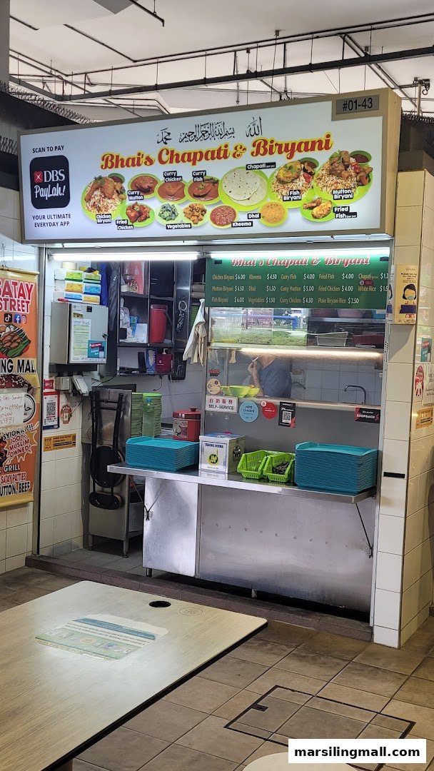 Front view of Bhais Chapati & Biryani food stall with menu board.