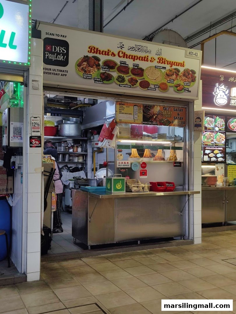 Exterior view of Bhai's Chapati & Biryani food stall with menu displays and payment options.