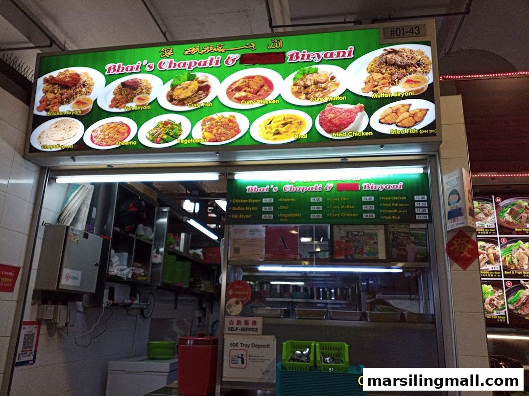 Exterior view of Bhais Chapati & Biryani food stall with a large illuminated menu board.