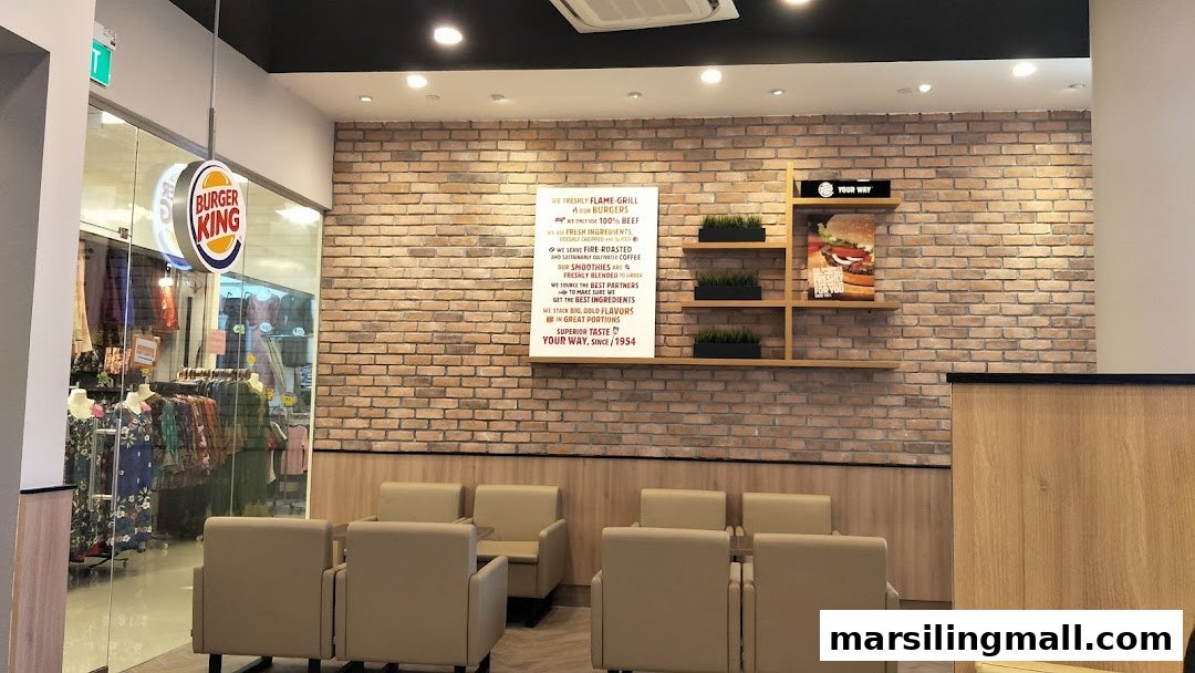 Interior view of Burger King's seating area with a glimpse of the entrance and signage.