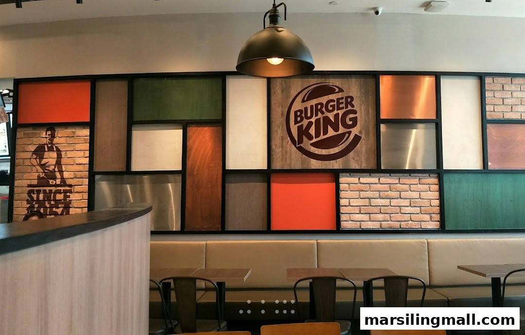 Interior view of Burger King featuring modern decor, seating, and brand elements.