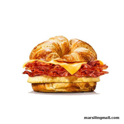 A close-up of a breakfast sandwich with bacon, egg, and cheese on a flaky croissant.