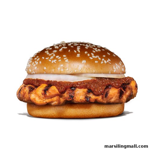 A close-up of a grilled chicken burger with sauce and onions on a sesame bun.