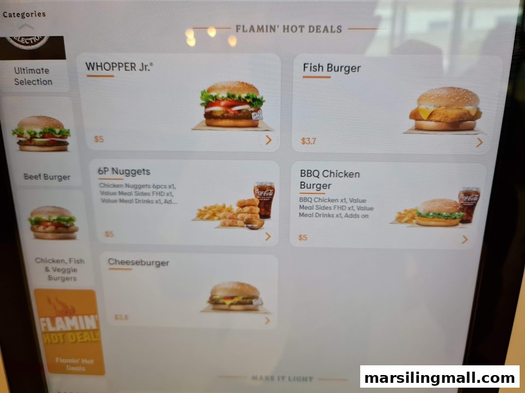 A digital menu board displaying various Burger King burgers and deals, including Whopper Jr. and Nuggets.