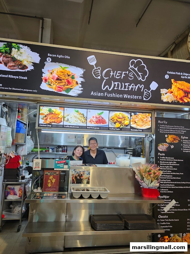 A food stall named Chef William Asian Fusion Western with staff and prominent menu boards displaying various dishes.