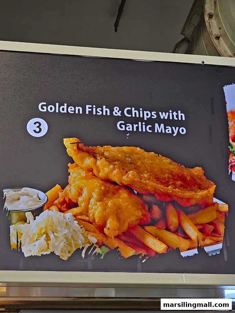A menu board displaying a delicious plate of Golden Fish & Chips with Garlic Mayo.