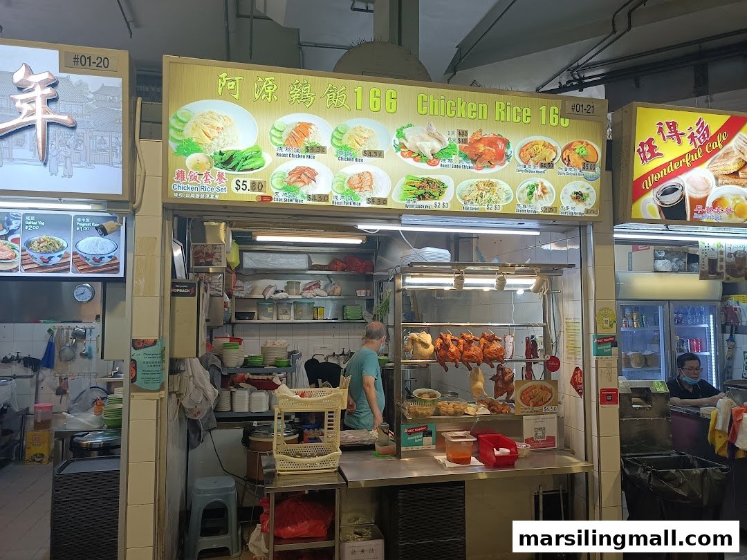 A bustling hawker stall, Chicken Rice 166, showcasing its menu and roasted chickens.