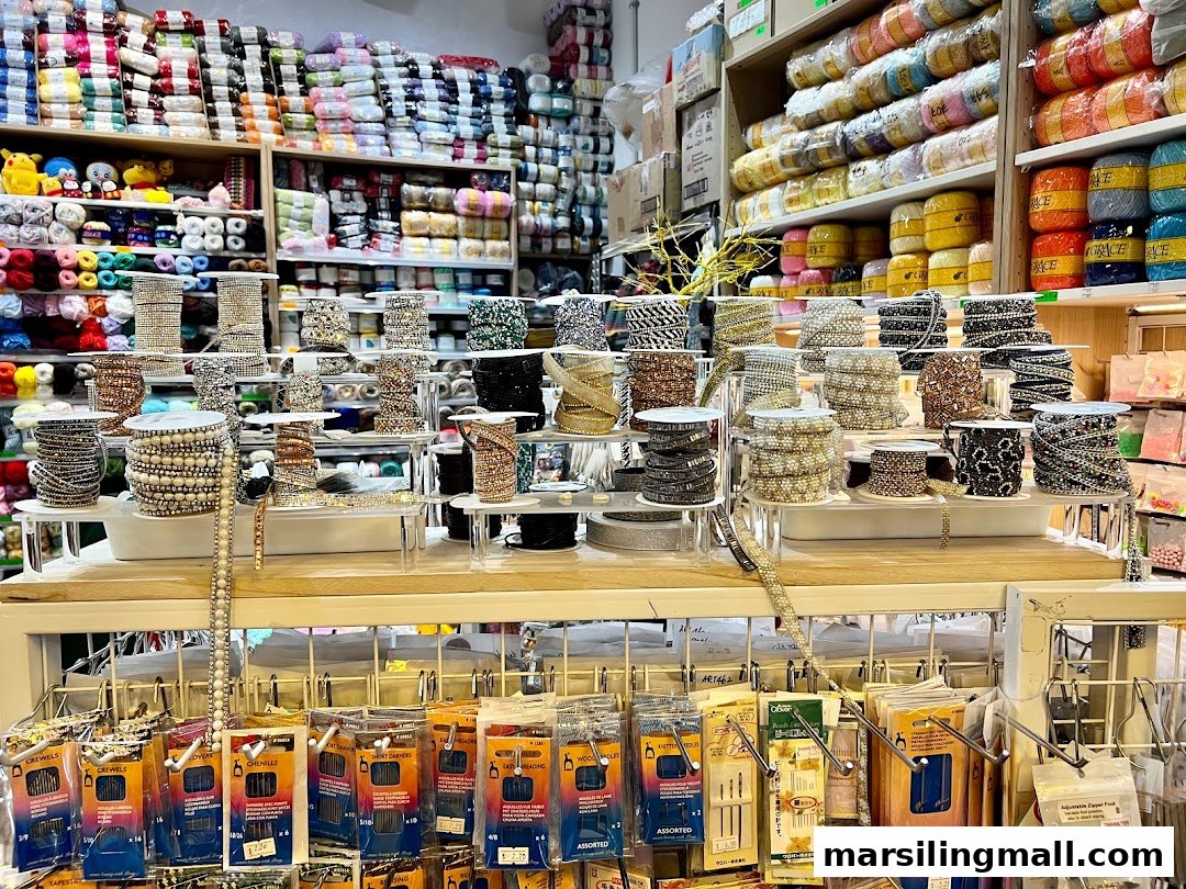 Shelves packed with colorful yarn, beads, and various crafting supplies at Crafting House.