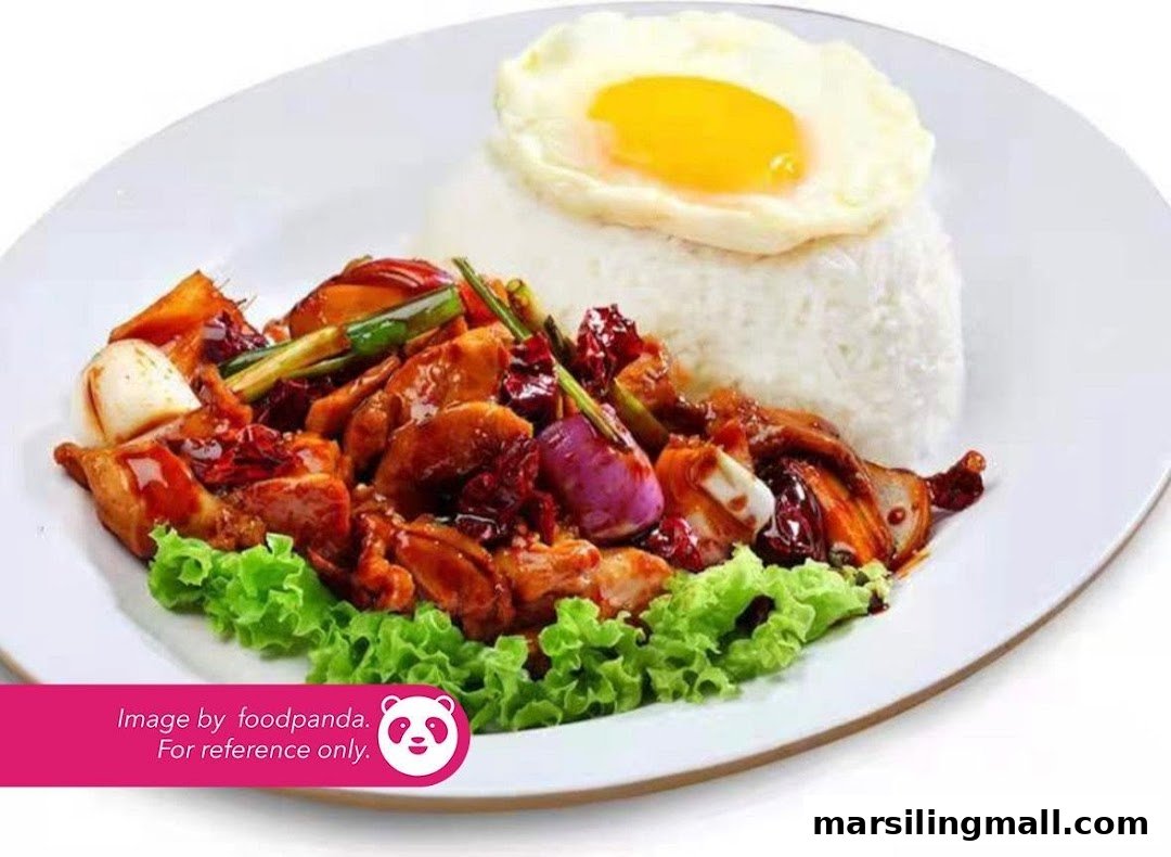 A plate of vegetarian stir-fry with rice and a fried egg, garnished with fresh lettuce.