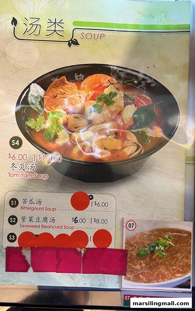 A menu board from En Hui Vegetarian, showcasing various soup options with prices.