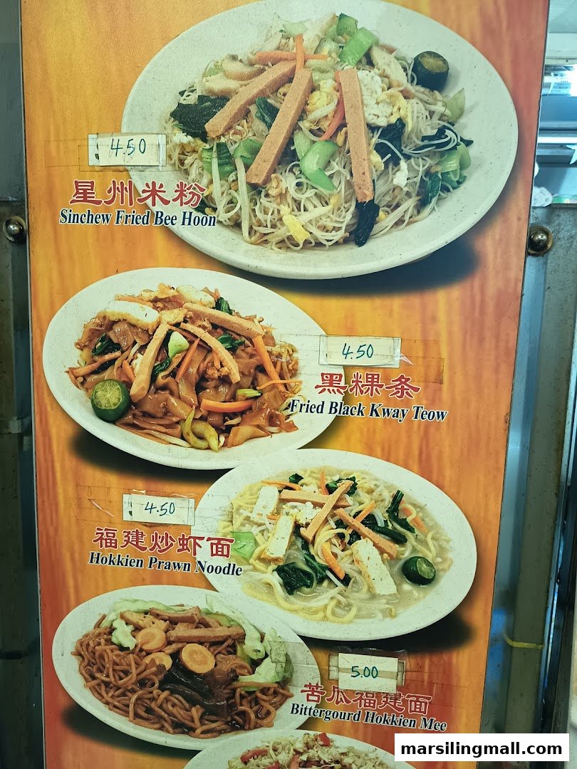 A vibrant menu board displaying various vegetarian noodle and bee hoon dishes with prices.