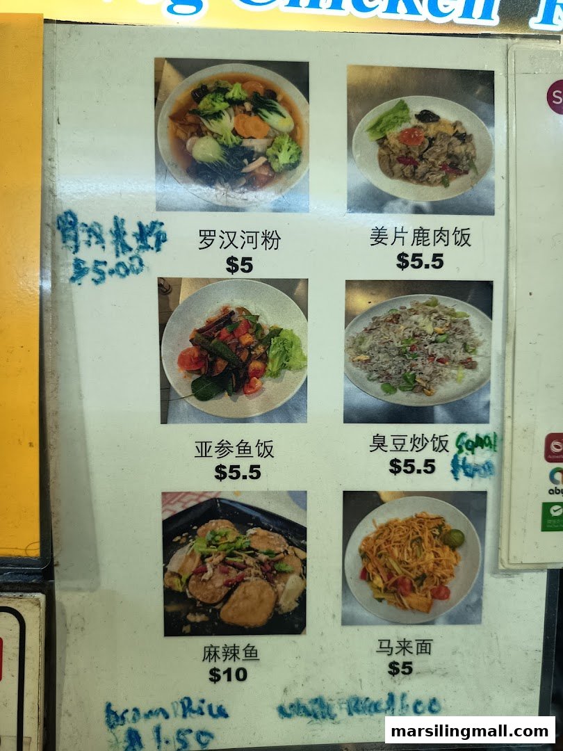A menu board displaying various vegetarian dishes with photos and prices at En Hui Vegetarian.