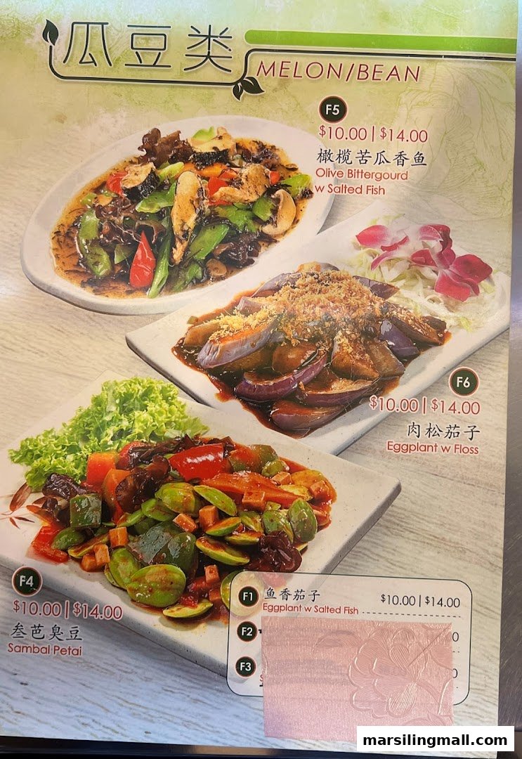 A menu page from En Hui Vegetarian displaying various vegetable and bean dishes with their prices.