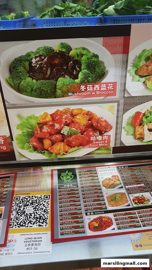A vibrant menu board for En Hui Vegetarian, showcasing popular dishes and a detailed price list.