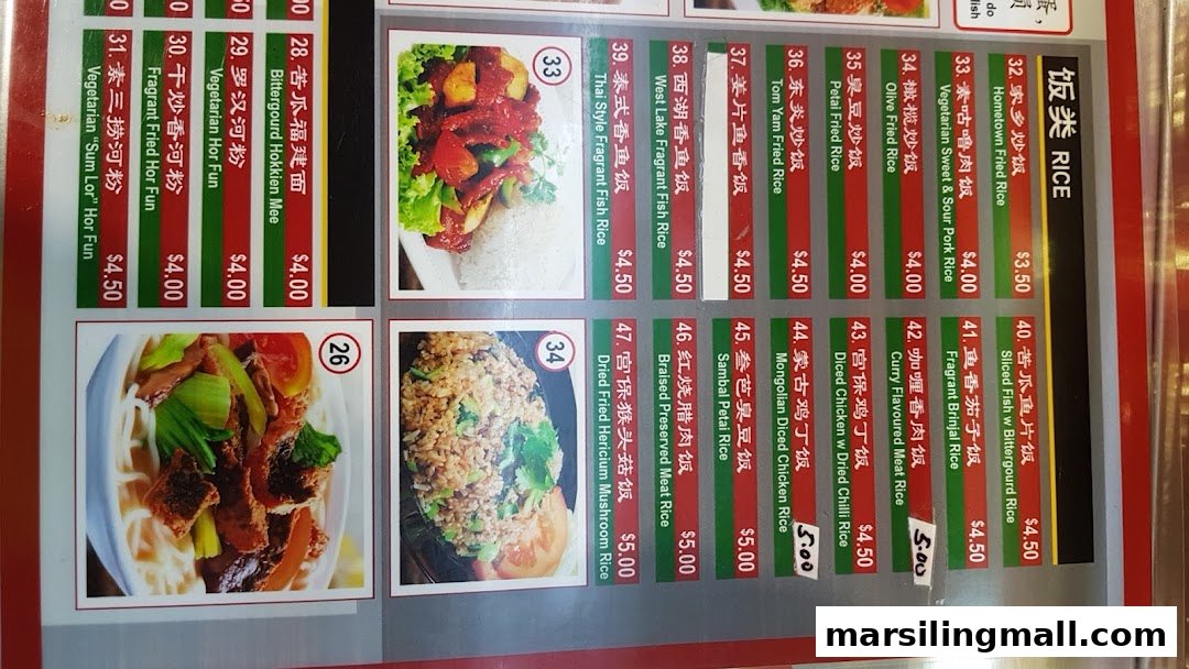 A detailed menu board displaying a variety of vegetarian rice and noodle dishes with prices.