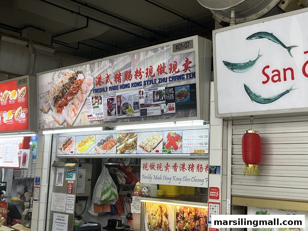 A vibrant food stall front showcasing freshly made Hong Kong style Zhu Chang Fen and other dishes.