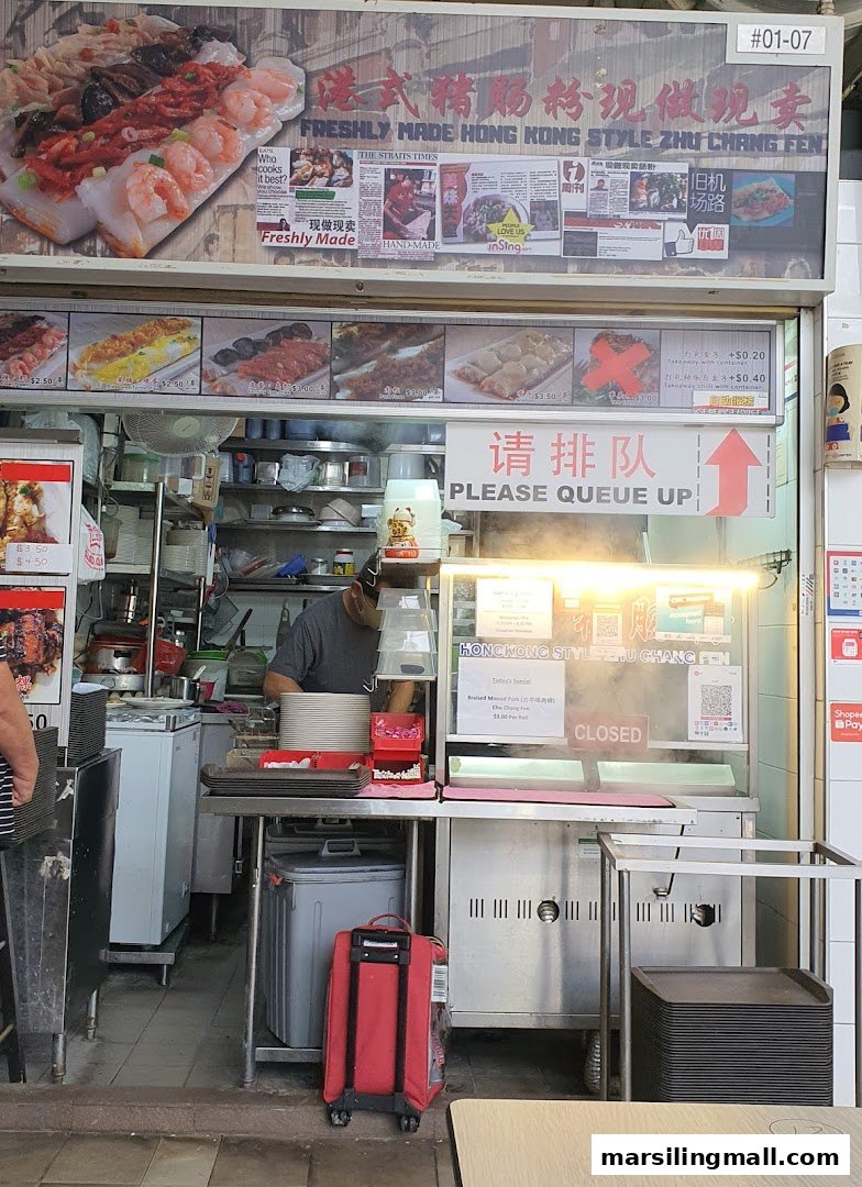 The bustling front of a Hong Kong style Zhu Chang Fen stall, currently closed, showcasing fresh ingredients.