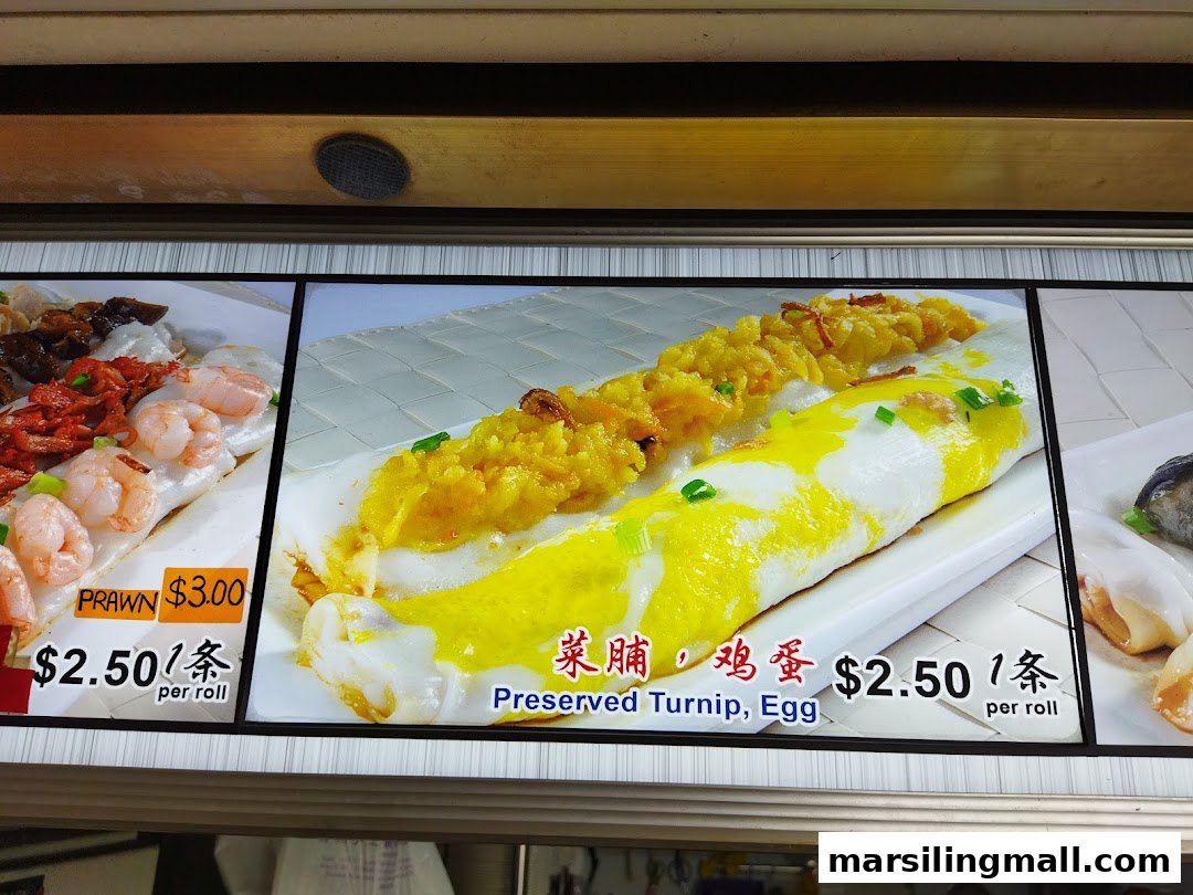Close-up of a menu board displaying various Hong Kong style chee cheong fun (rice rolls) with prices.