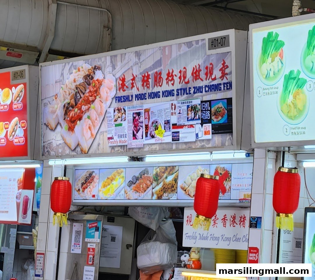 A vibrant food stall showcasing freshly made Hong Kong style Zhu Chang Fen and fish soup options.